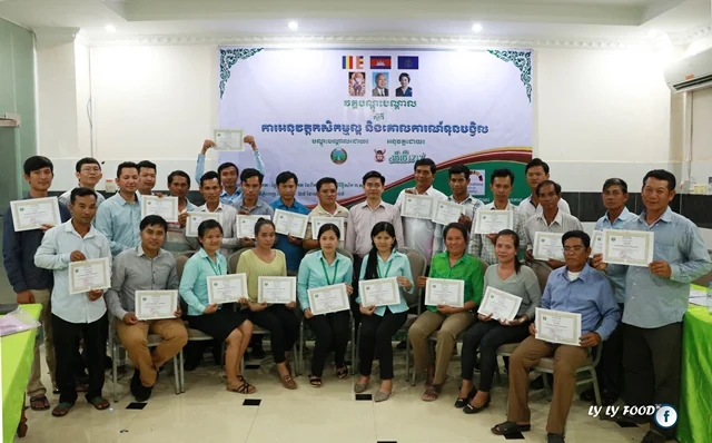 Farmer representatives holding certificates after the Cam-GAP training